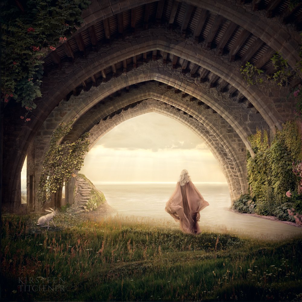 lady in arched tunnel looking out to sea
